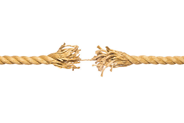 istock A frayed piece of string hanging by a thread 176110104