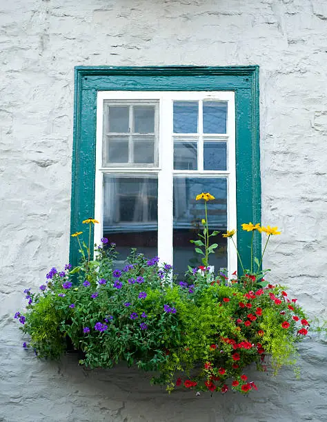 "Historic window with flowers in Quebec City, Quebec, Canada"