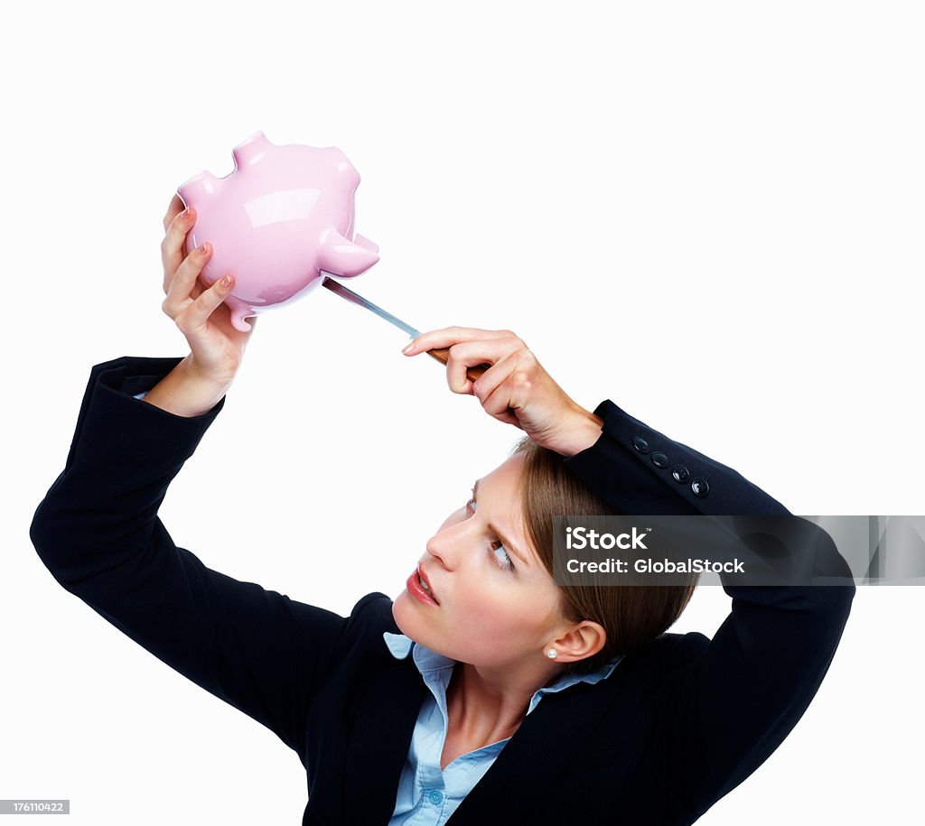 Mulher utilizar a faca para retirar dinheiro em um piggybank - Royalty-free 20-24 Anos Foto de stock