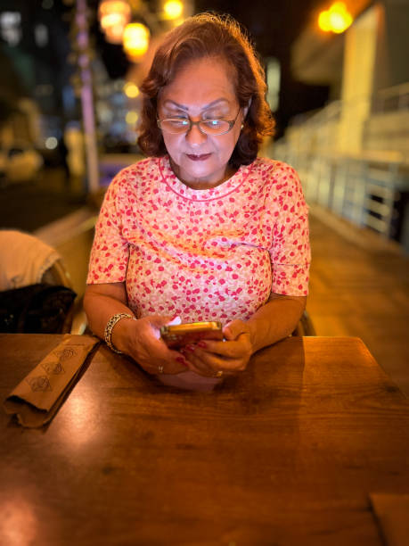 istock Senior Hispanic woman restaurant at night 1761105813