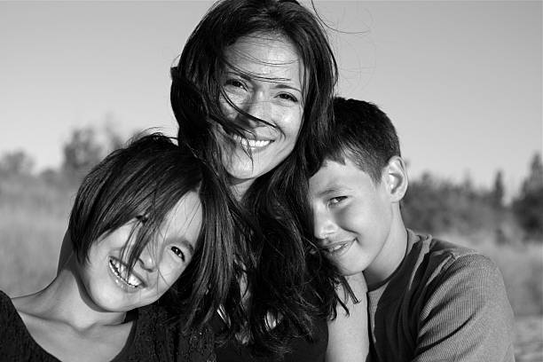 istock Mother holding her children in black and white 176110869