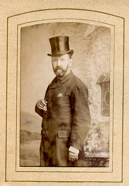 Victorian Gentleman Top Hat "Vintage photograph of a Victorian man cira. 1870 to 1880, wear a top hat and holding a pocket watch" 19th century style photos stock pictures, royalty-free photos & images