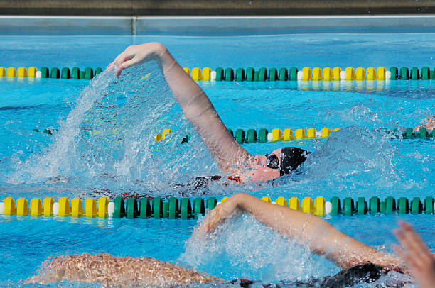 istock Young Girl Athlete Backstroke Swimmer Racing in Pool 176112029