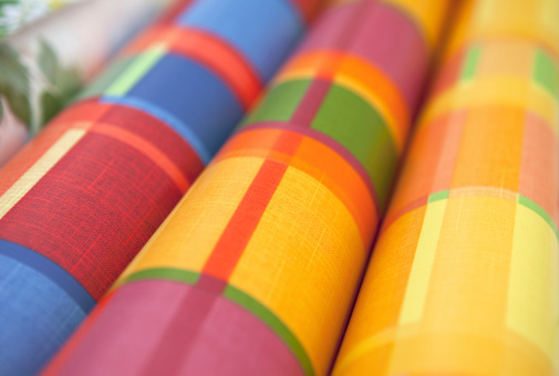 Detail of colored plastic tablecloths on a market stall