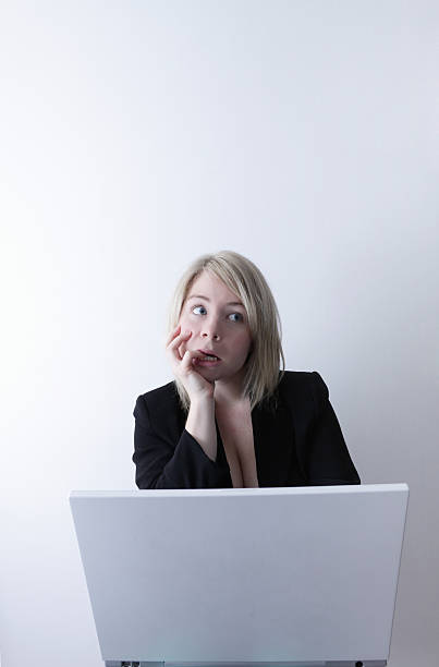 istock Office Woman going crazy with laptop 176114147