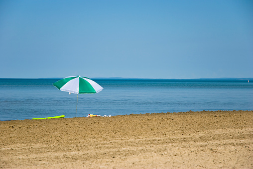 Lonely umbrella on the beach