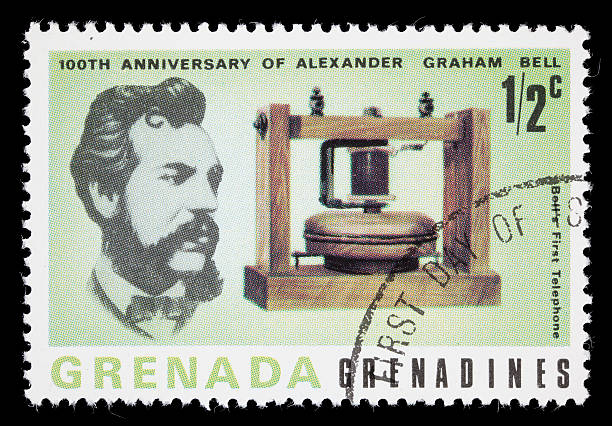 Bell and first telephone postage stamp 1977 Grenada postage stamp with images of Alexander Graham Bell and the first telephone created. DSLR with macro lens; no sharpening. alexander graham bell stock pictures, royalty-free photos & images
