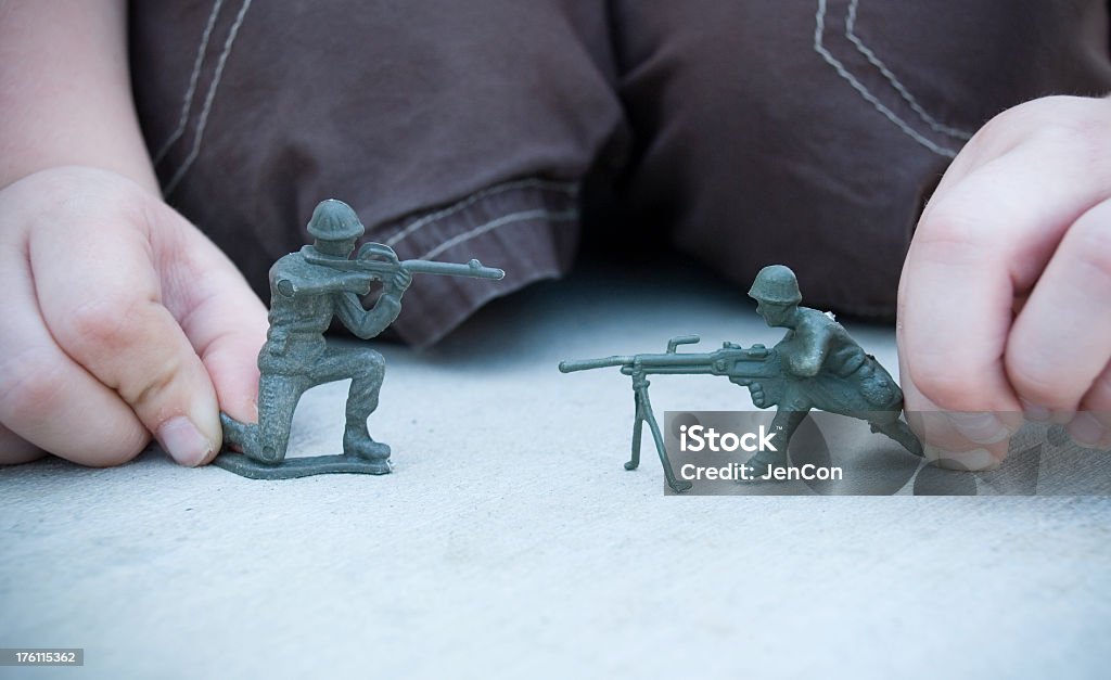 Army guys Child playing with army guys 4-5 Years Stock Photo