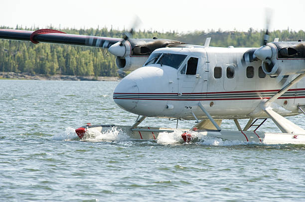 Taking Off in a Twin Otter DHC-6. A Twin Otter DHC-6 float plane taxis for it's takeoff run. great slave lake stock pictures, royalty-free photos & images
