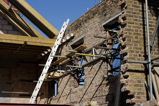 istock Roof timbers and ladder in house construction site 176116324