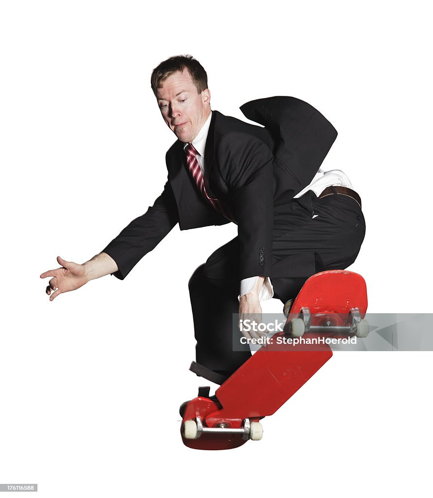 Businessman in a suit showing off skateboarding, isolated on white SLC Minilypse 2009. Adobe RGB.Click for more skateboarders in action: Businessman Stock Photo