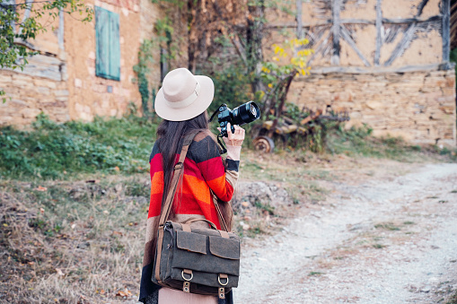 Female artist photographer enjoying autumn in the countryside