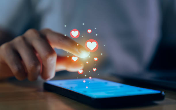 istock Hand using smartphone and chatting on social media with show heart icon. 1761169668