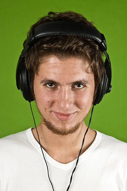 istock young man listening music 176117611