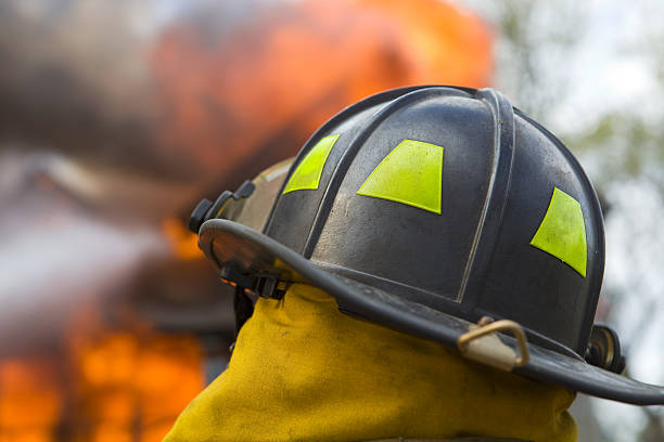istock Firefighter in front of a House Fire 176117636