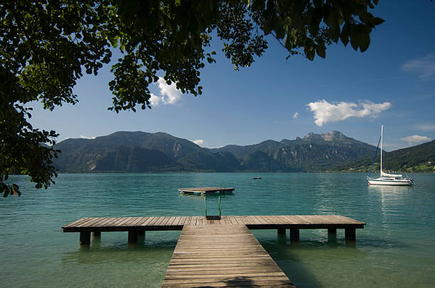 Mountains and jetty "Beautiful landscape, Attersee, Austria.See more pics:" attersee stock pictures, royalty-free photos & images