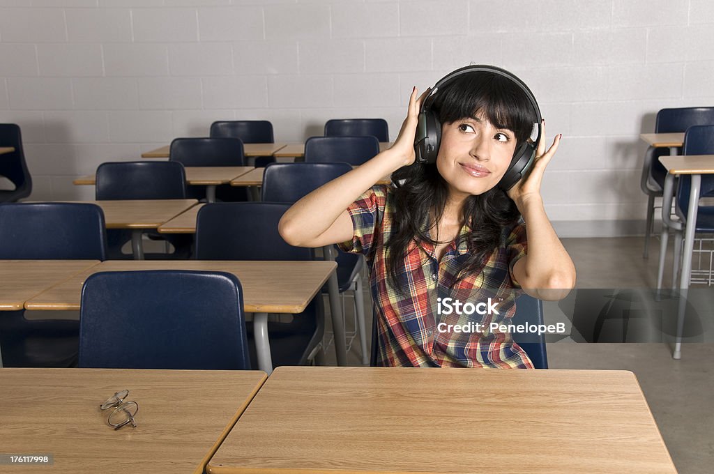 Mature Student An ethnic woman who has gone back to school as a mature student listening to audio tapes in the classroomEchucalypse 2009 Toronto Adult Stock Photo