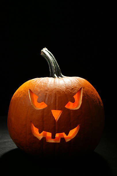 istock halloween pumpkin at night 176118272