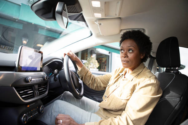 istock Female driver inside a car getting ready to start a journey 1761182996