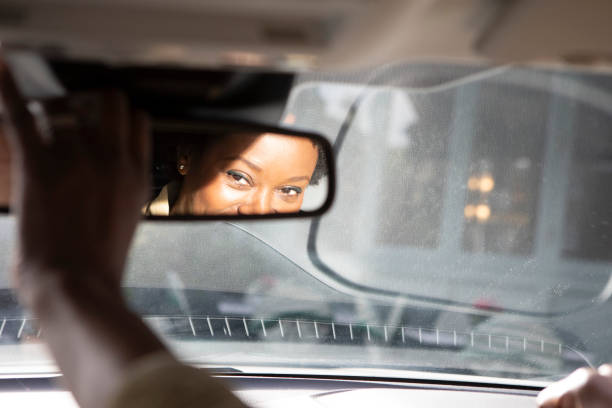 istock Woman's eyes in a rear view mirror 1761183552