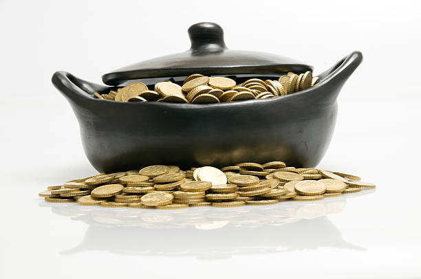 Black bowl and gold coins