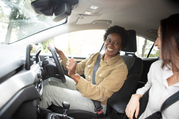 istock Two smiling women inside a car before starting a journey 1761187193