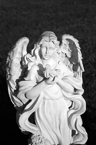 istock Beautiful Angel Statue Holding A Dove  B&W 176118889
