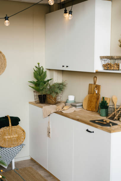 istock Minimalistic white kitchen in Scandinavian style, decorated for Christmas and New Year 1761189116