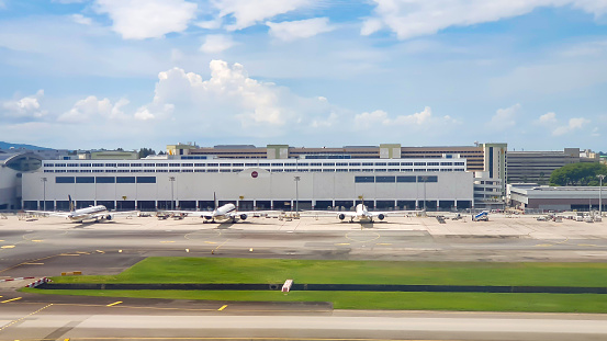 Changi, Singapore - ‎‎‎‎‎‎‎‎‎June 9, 2023 : SATS Airfreight Terminal And Commercial Airplane At Changi Airport. SATS Supports One Of The World's Busiest Air Cargo Operations At Changi Airport.