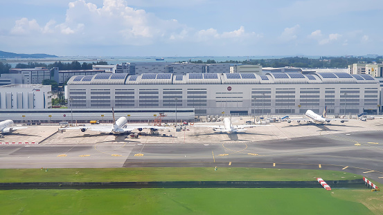 Changi, Singapore - ‎‎‎‎‎‎‎‎‎June 9, 2023 : SATS Airfreight Terminal And Commercial Airplane At Changi Airport. SATS Supports One Of The World's Busiest Air Cargo Operations At Changi Airport.