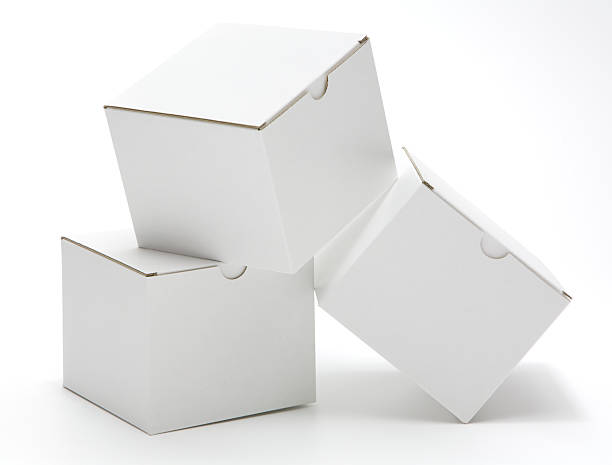 Three cube shaped blank white cartons isolated stock photo