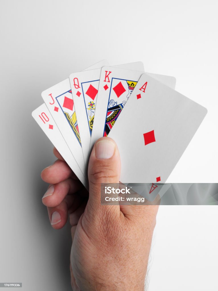 Holding Diamonds in a game of Cards "Holding the ten, jack, queen, king and ace of diamonds cards aloft.Click on the link below to see more of my gambling images." Ace Stock Photo