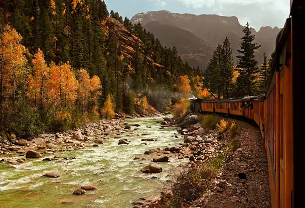 "View from the Durango & Silverton Narrow-gauge Railroad & locomotive traveling through the San Juan mountains in autumn.  Animas River, near Silverton, Colorado.  Minerals give the water its unique green color.See all my SAN JUAN MTNS images:"
