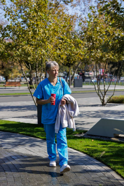 istock A Nurse Carries Coffee On Her Way To Work 1761205439