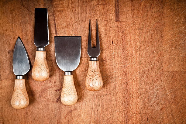 istock Group of cheese knifes on chopping board 176120650