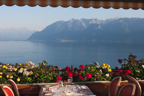 Table setting in an elegant restaurant overlooking Lake Geneva