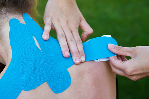 istock hands of a physiotherapist 176121460