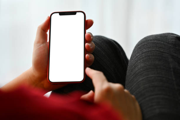 istock Close up man texting messages, chatting in social while lying on couch at home 1761221259