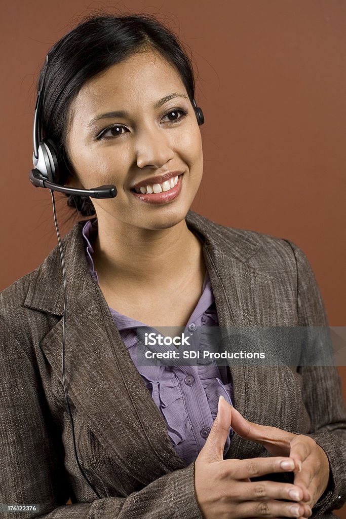 Smiling Customer Service Person with Hands Together Smiling Customer Service Person with Hands Together.See more of this series: Adult Stock Photo