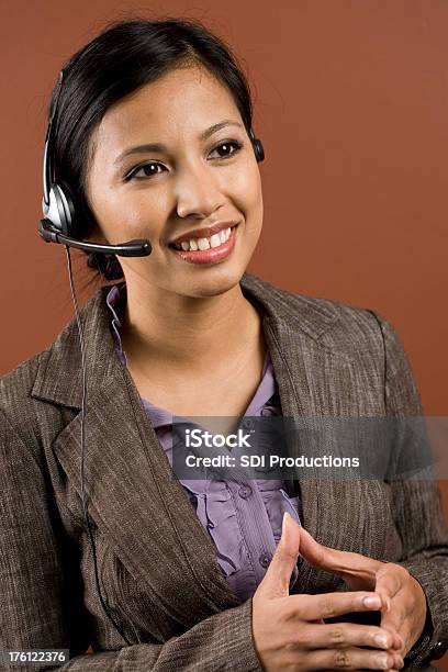 Smiling Customer Service Person With Hands Together Stock Photo - Download Image Now