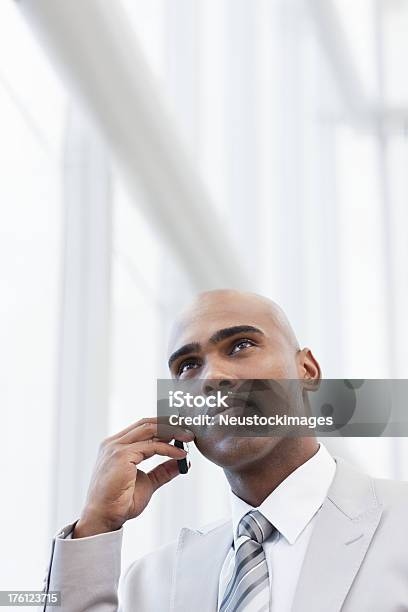 Young Businessman Talking On A Cellphone Stock Photo - Download Image Now - 20-24 Years, 20-29 Years, Adult