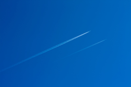 Two planes flying in clear sky. Adobe RGB