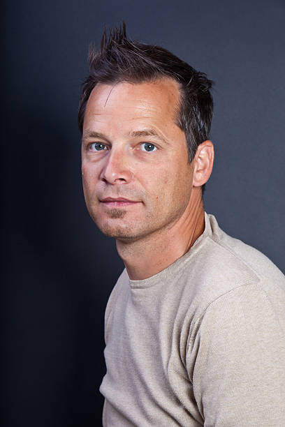 istock Portrait of a young man looking into camera 176124074