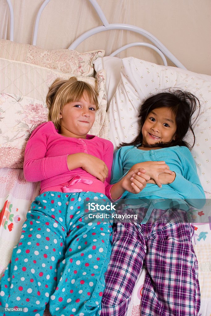 Little girls at sleepover Two elementary-aged girls enjoying one of their first sleepovers 6-7 Years Stock Photo