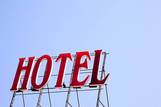 istock Hotel Sign Stands Starkly Against Clear Blue Sky, Copy Space 176124822