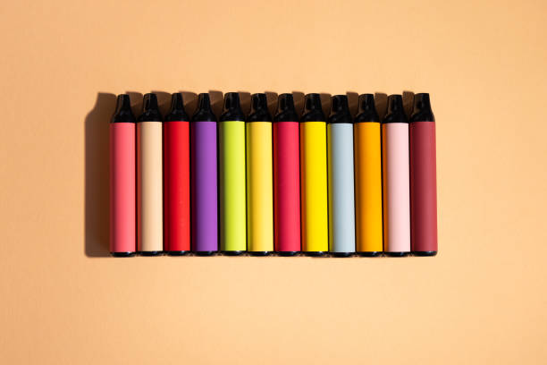 istock Assortment of disposable e-cigarettes  Vapor system, top vew. 1761252552
