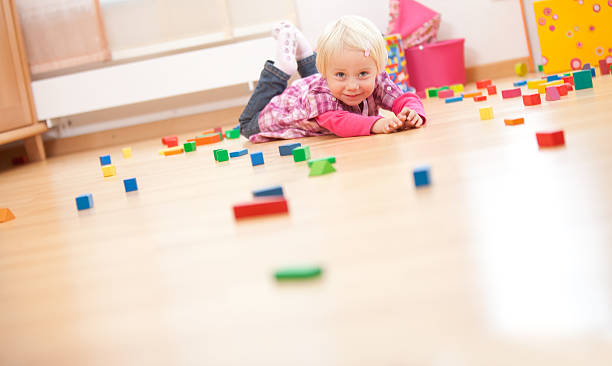 istock girl is playing with her blocks (copy space) 176125449