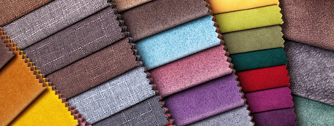 Sample of velvet and velour textile of different colors, background. Catalog and set tone of Interior fabric for furniture, closeup. Collection of multicolored cloth with wicker pattern.