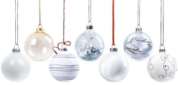 Shiny red Christmas ball on the ribbon insulated on a white background