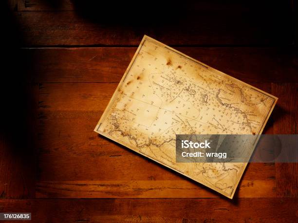 Treasure Map On A Wooden Table Stock Photo - Download Image Now - Nautical Chart, Table, Treasure Map